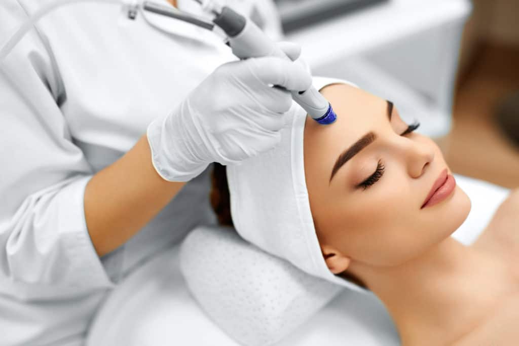 Young Attractive Woman Taking Diamond Glow Facial | Vibe Aesthetics in Hood River, OR
